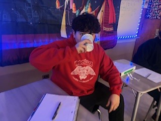 Josef D  Suarezdelreal enjoys his Mexican hot chocolate during the Dia De Reyes celebration in Ms. Sosa's class. Mexican hot chocolate is traditionally made with chocolate, cinnamon, and milk or water, creating a warm, lightly spiced drink that is less sweet than American hot chocolate.