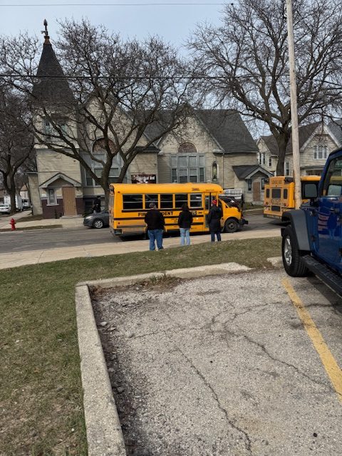Support staff monitor dismissal along Russell Avenue, ensuring all buses arrive and students board safely at the end of the school day.
