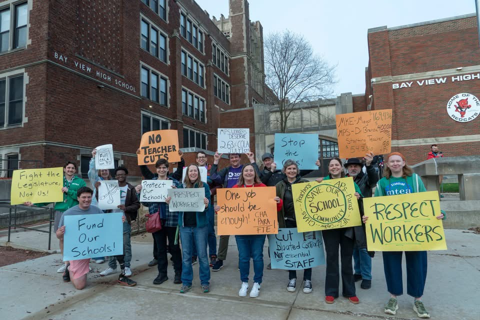 Members of the Bay View High School MTEA union rally outside the school April 17, 2026, in Milwaukee, calling for no staff cuts and a cost-of-living increase for all workers effective July 1.
