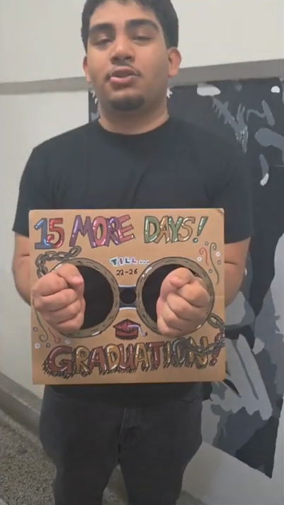 Senior Jaris Eguizabal-Banos takes part in a short music video coutdown to graduation produced by Haysham Shamshu Alam using cardboard art by Haysham.